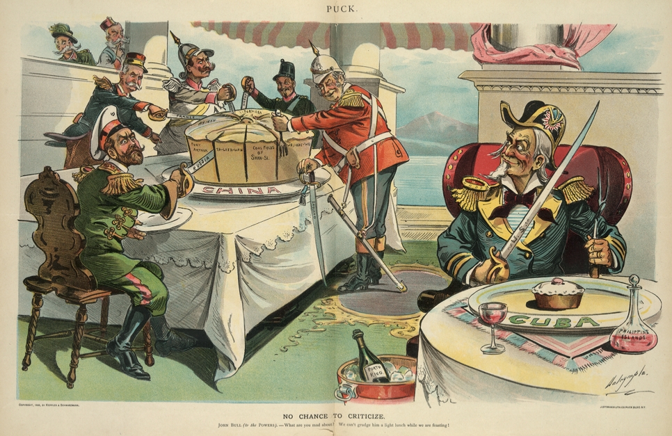 Political cartoon, "No chance to criticize" by Louis Dalrymple, published in Puck, v. 43, no. 1107, (1898 May 25), centerfold. Print shows Uncle Sam wearing a military uniform and holding a sword labeled "U.S.", sitting at a table on which is a small cake on a platter labeled "Cuba", with a decanter labeled "Philippine Islands" on the table and a bottle labeled "Porto Rico" [i.e. Puerto Rico] in an ice bucket. On the left, John Bull is holding a sword labeled "England", slicing a large cake on a platter labeled "China"; around the table, with him, are four figures representing "Russia" (Nicholas II), "France" (Felix Faure), "Germany" (William II), and "Japan" (Meiji), each using a sword to carve up the cake which is labeled "Wei-Hai-Wei, Coal Fields of Shan-Si, Ta-Lien-Wan, Port Arthur, Hainan, Kai Chau, [and] Formosa". Looking on from behind a wall on the far left are Italy (Umberto I) and Austria (Franz Joseph I).